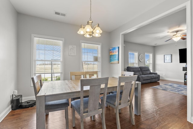 dining area with visible vents, wood finished floors, a wealth of natural light, and baseboards