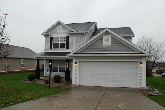 view of front of house with a porch, a front yard, and a garage