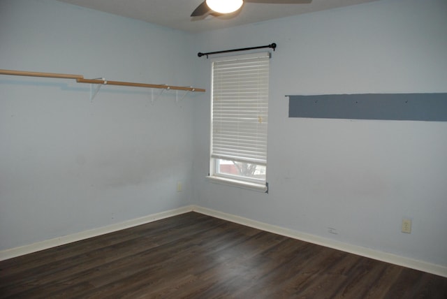 unfurnished room featuring dark hardwood / wood-style floors and ceiling fan