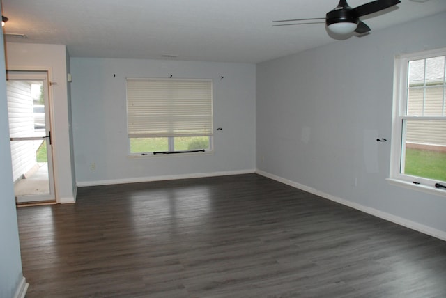 unfurnished room with ceiling fan and dark hardwood / wood-style floors