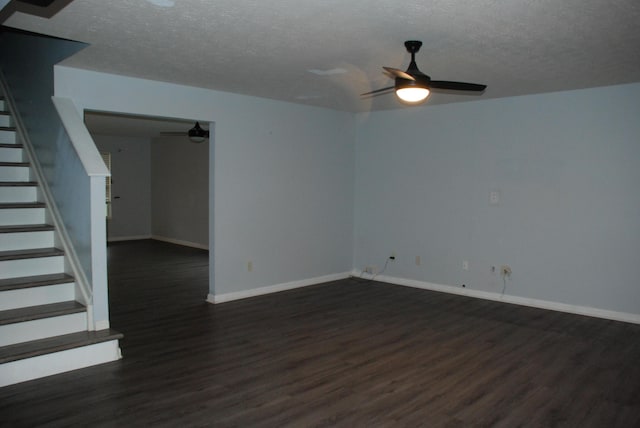 unfurnished room featuring a textured ceiling, dark hardwood / wood-style flooring, and ceiling fan