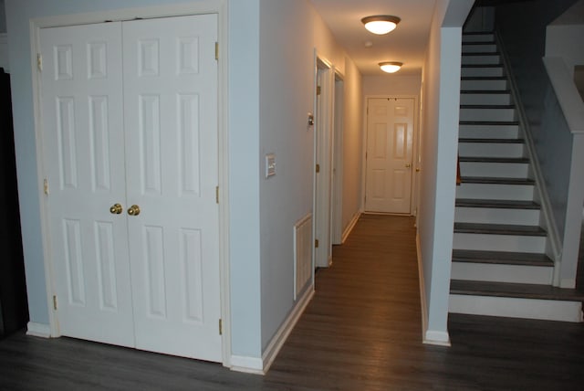 corridor featuring dark hardwood / wood-style flooring