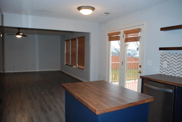 interior space featuring stainless steel dishwasher, ceiling fan, dark hardwood / wood-style floors, blue cabinetry, and butcher block counters