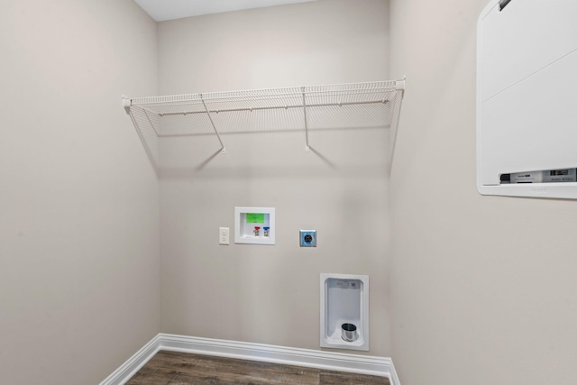 laundry area featuring dark hardwood / wood-style flooring, hookup for an electric dryer, and washer hookup