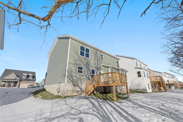 rear view of house featuring a deck