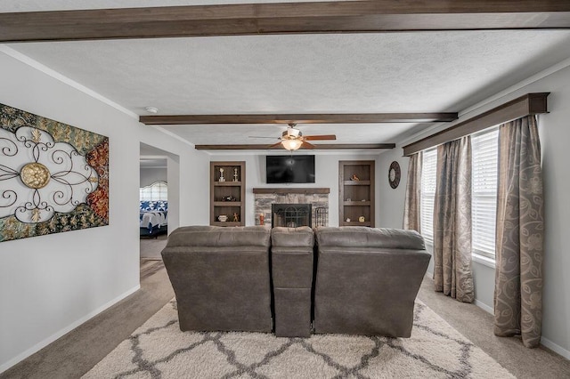 living room with light carpet, a stone fireplace, ceiling fan, and built in features