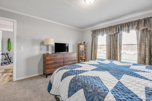 carpeted bedroom featuring crown molding and a textured ceiling