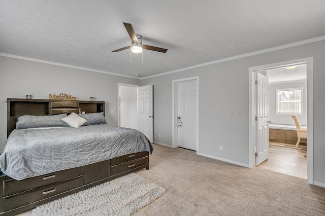 carpeted bedroom with ensuite bath, ceiling fan, and ornamental molding