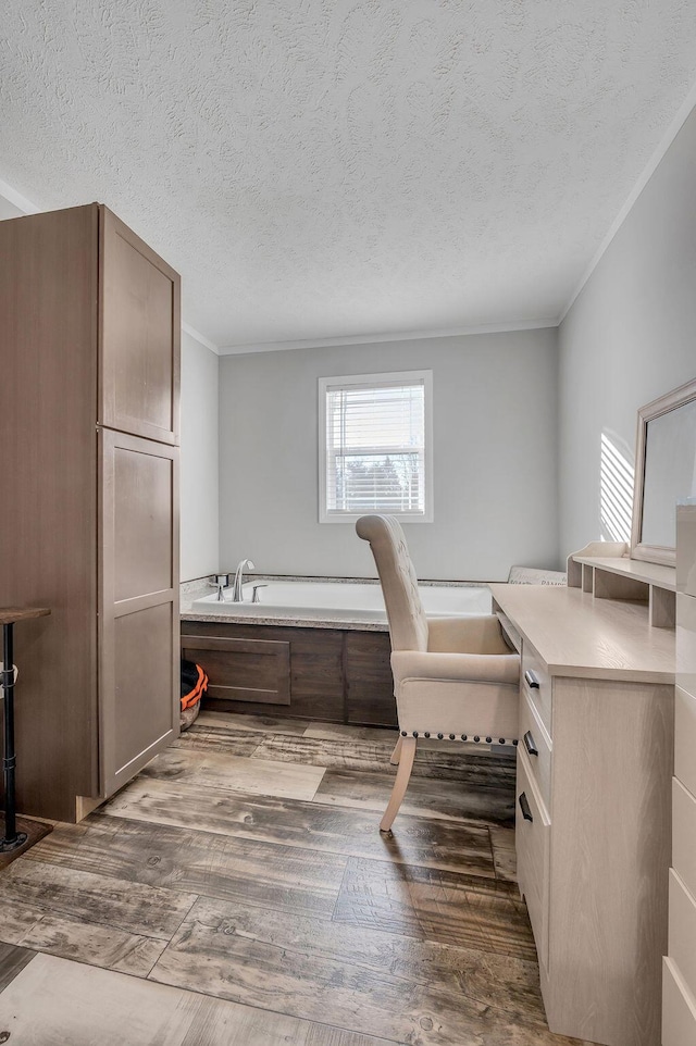 office featuring dark hardwood / wood-style floors, a textured ceiling, and ornamental molding