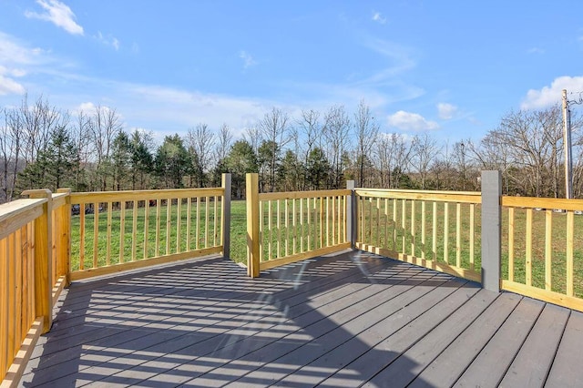 wooden deck with a lawn