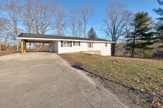 single story home with a front yard and a carport