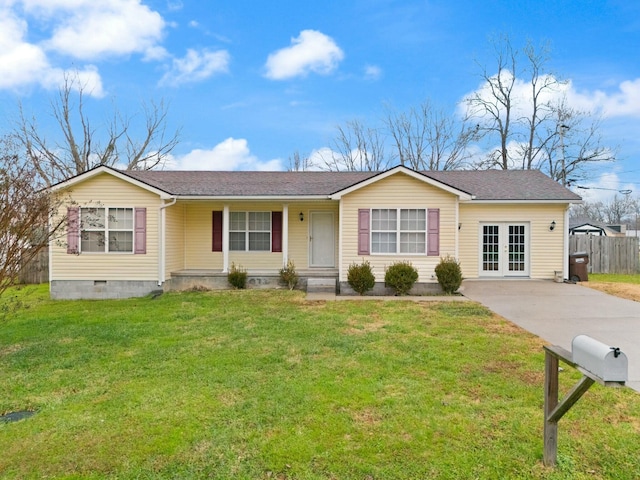 view of front of property featuring french doors and a front lawn