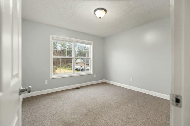 empty room with carpet flooring