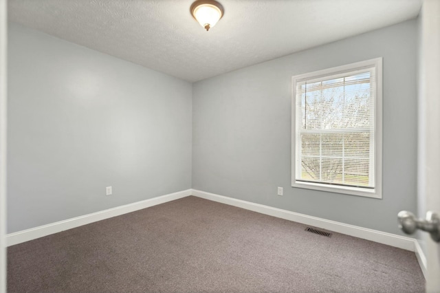 empty room featuring carpet floors