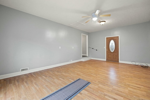 entrance foyer with ceiling fan and light hardwood / wood-style flooring