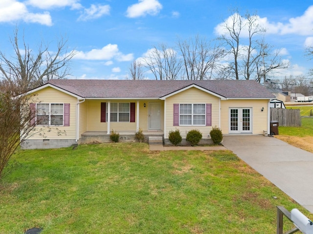 ranch-style home with french doors and a front lawn