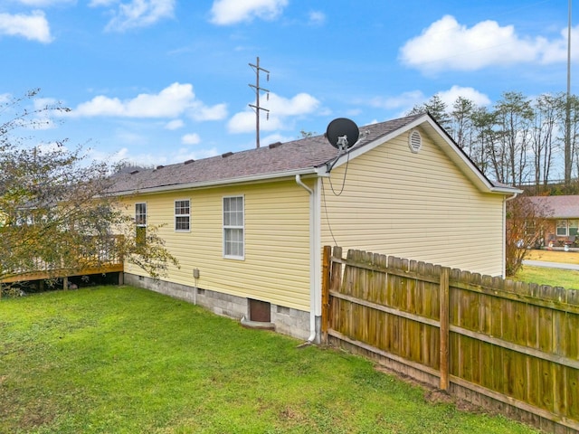 back of house featuring a yard