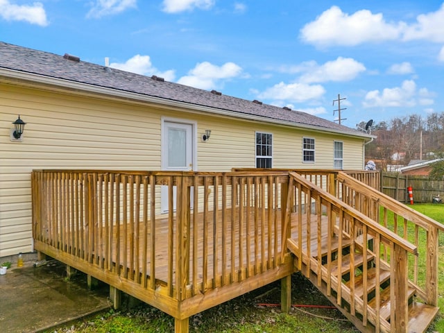 back of house with a deck