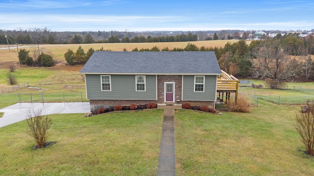 view of front of property featuring a rural view and a front yard