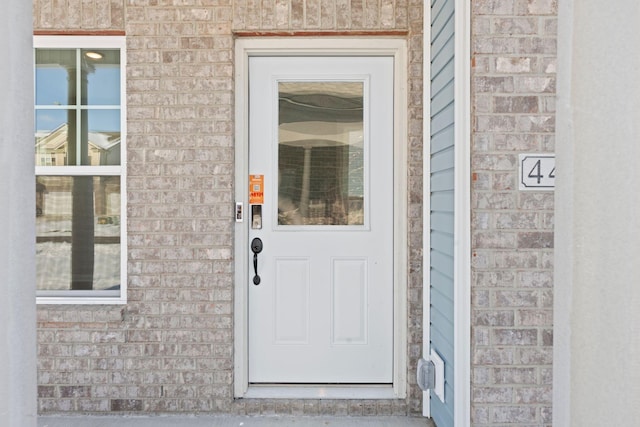 entrance to property with brick siding