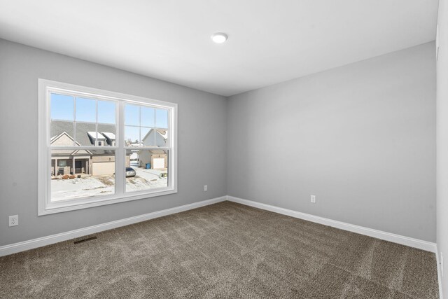 unfurnished bedroom with baseboards, a closet, visible vents, and carpet flooring