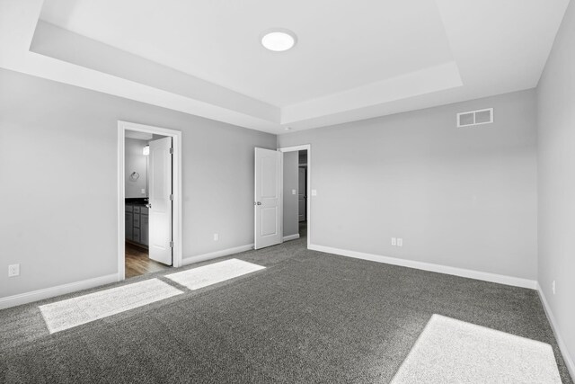 full bath with double vanity, a sink, a tile shower, wood finished floors, and baseboards