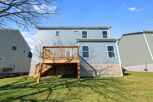 back of property with a lawn, stairway, a deck, and central air condition unit