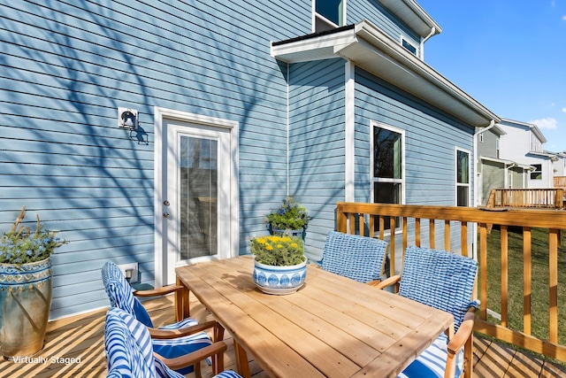 deck featuring outdoor dining area