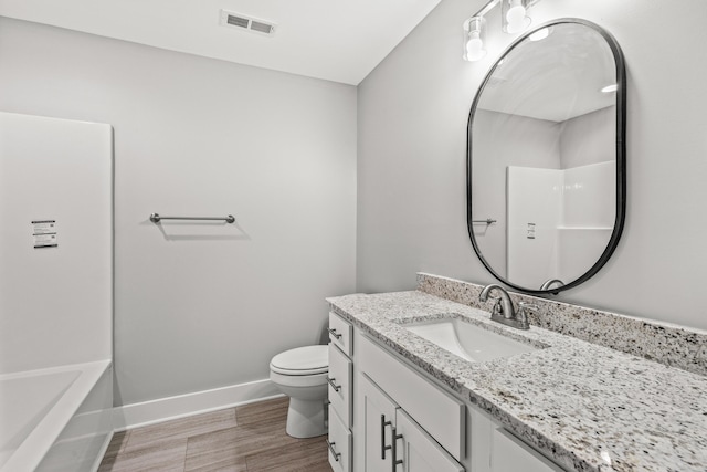 full bathroom featuring vanity, toilet, and bathtub / shower combination