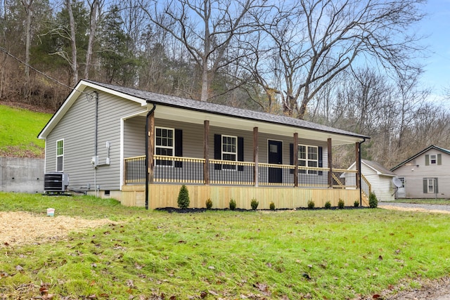 view of front of property featuring a front yard and central air condition unit