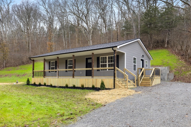 view of front of home featuring a porch and a front lawn