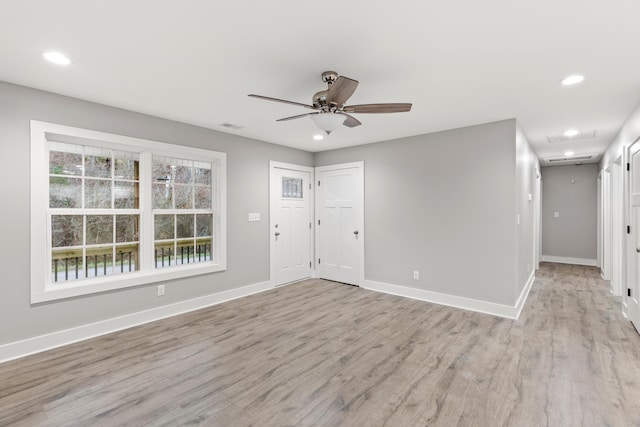 entryway with ceiling fan and light hardwood / wood-style floors