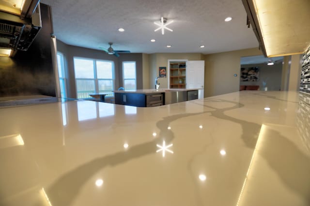 kitchen with ceiling fan and beverage cooler