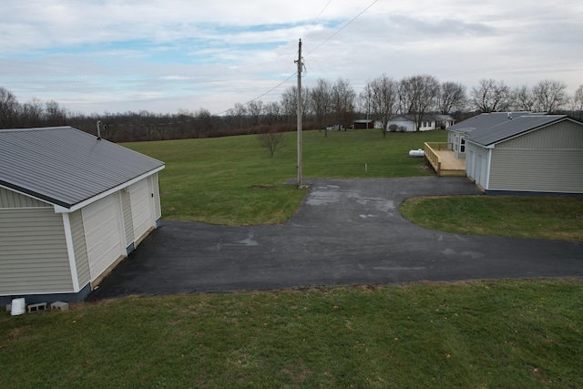 view of yard with a garage and an outdoor structure