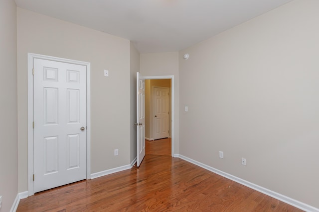 unfurnished bedroom featuring hardwood / wood-style floors