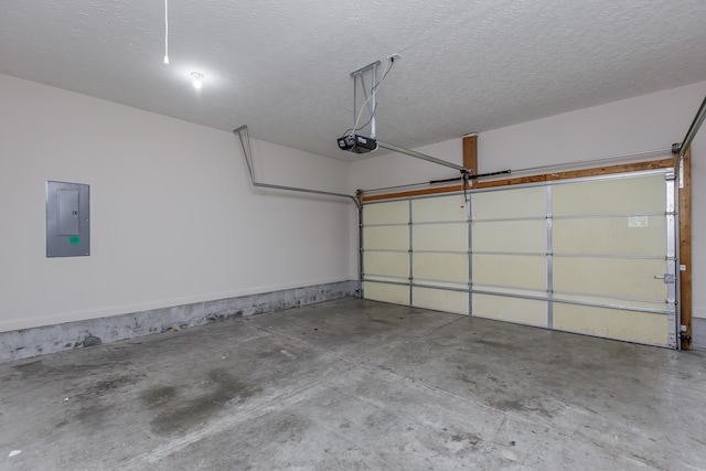 garage featuring electric panel and a garage door opener