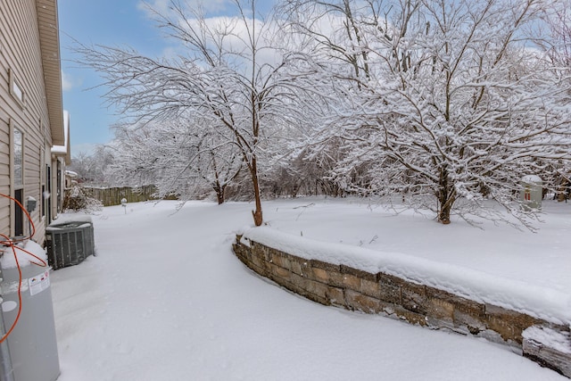 yard covered in snow with central AC