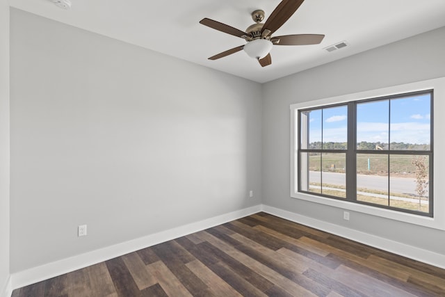 unfurnished room featuring ceiling fan and dark hardwood / wood-style flooring