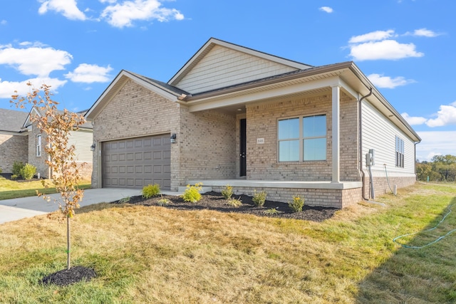 view of front of home with a garage and a front lawn