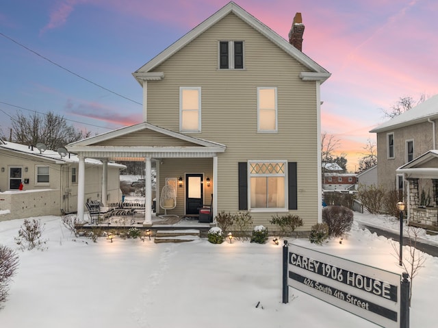 view of snow covered house