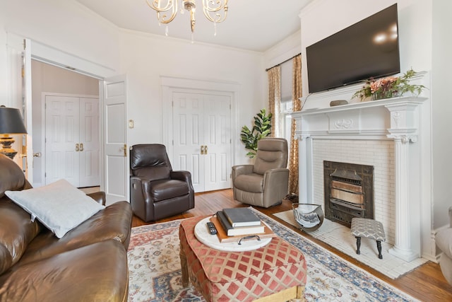 424 S 4th St, Danville, KY 40422 - living area featuring wood finished floors, a chandelier, and a fireplace