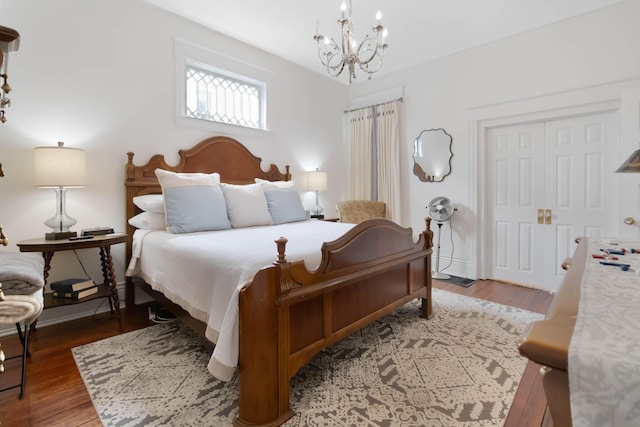 424 S 4th St, Danville, KY 40422 - bedroom with a chandelier, wood finished floors, and a closet