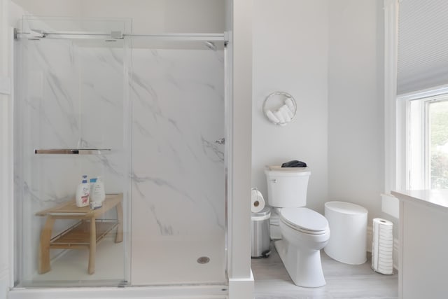 424 S 4th St, Danville, KY 40422 - bathroom with a marble finish shower, toilet, and wood finished floors