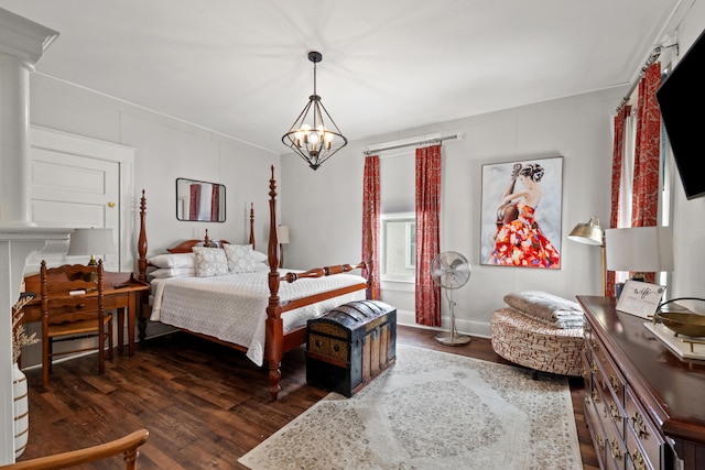 bedroom with dark hardwood / wood-style flooring and an inviting chandelier