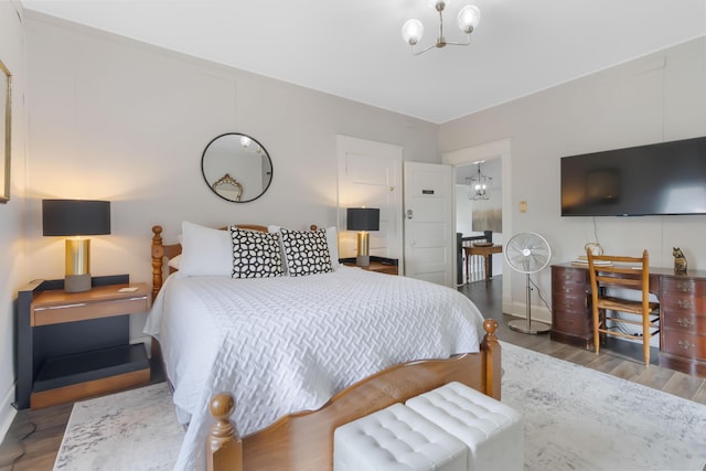 424 S 4th St, Danville, KY 40422 - bedroom with a chandelier, wood finished floors, and baseboards