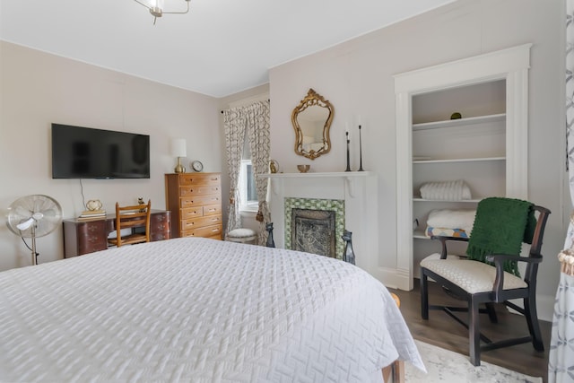 424 S 4th St, Danville, KY 40422 - bedroom with a tiled fireplace and wood finished floors
