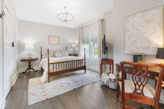 424 S 4th St, Danville, KY 40422 - bedroom featuring a chandelier, baseboards, and wood finished floors