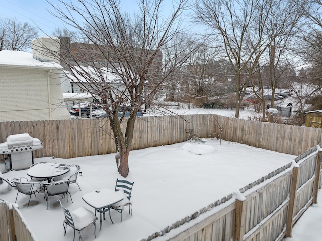 view of yard layered in snow