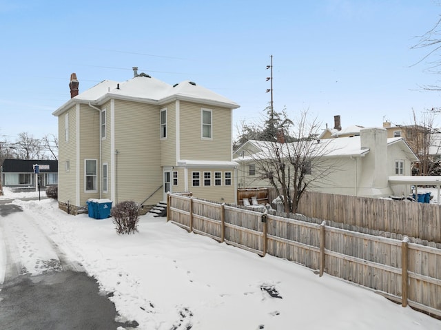 view of snow covered house