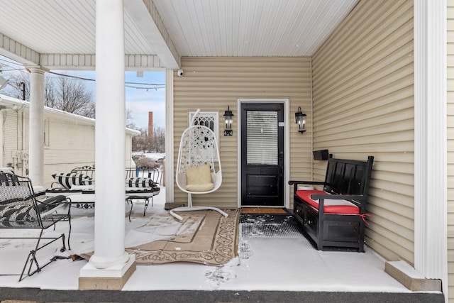 view of snow covered property entrance